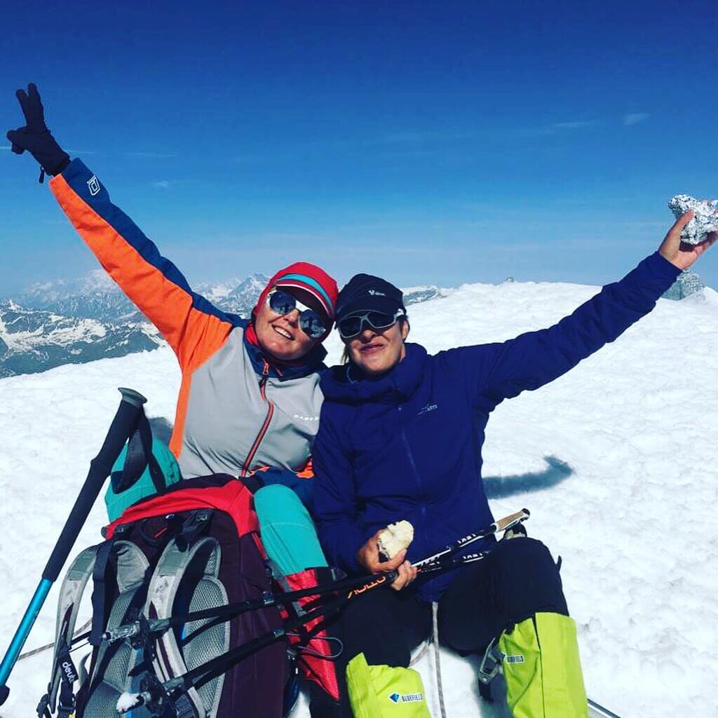 Happy guests on top of Castor mountain in Switzerland